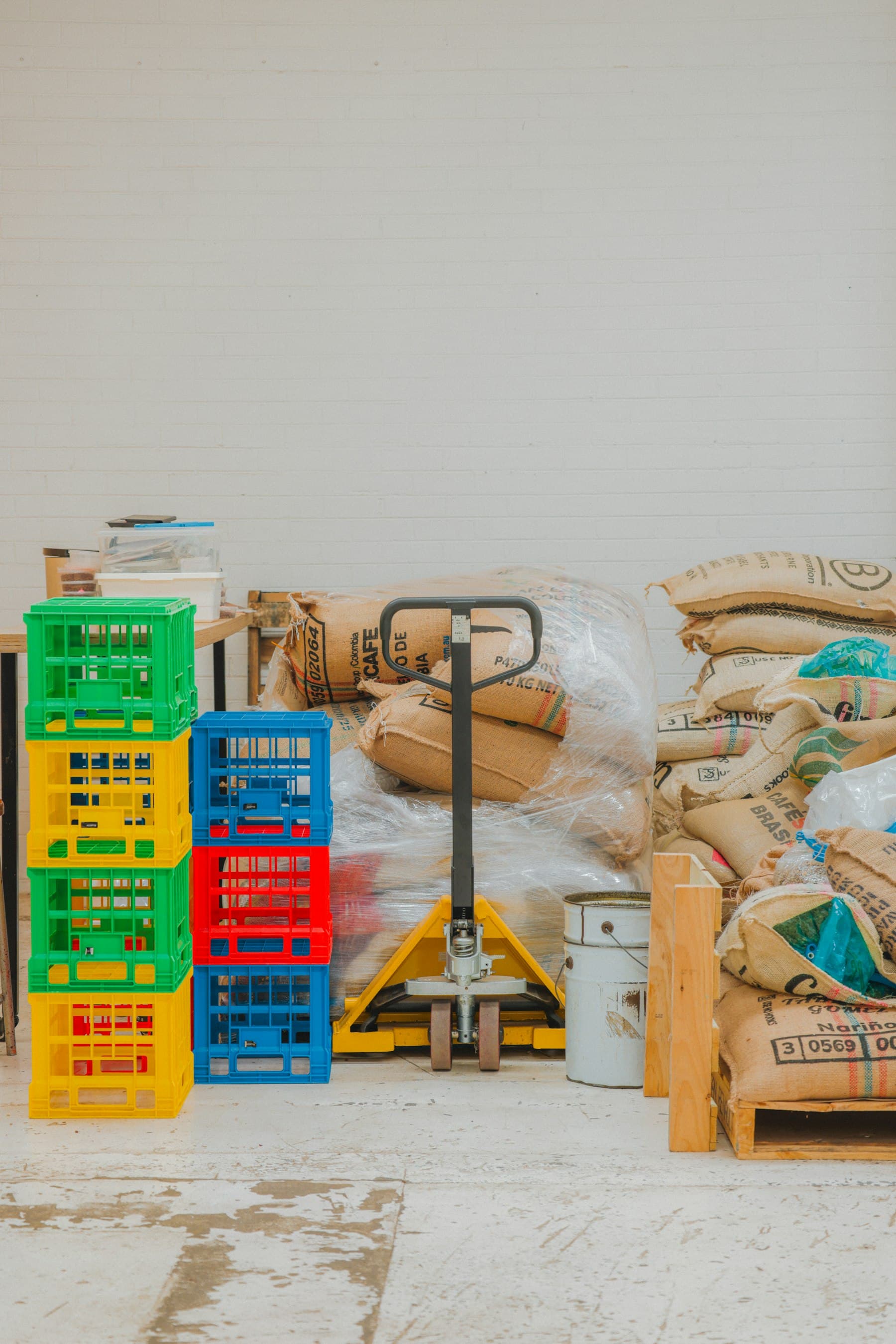 Sacks of coffee stacked in a warehouse